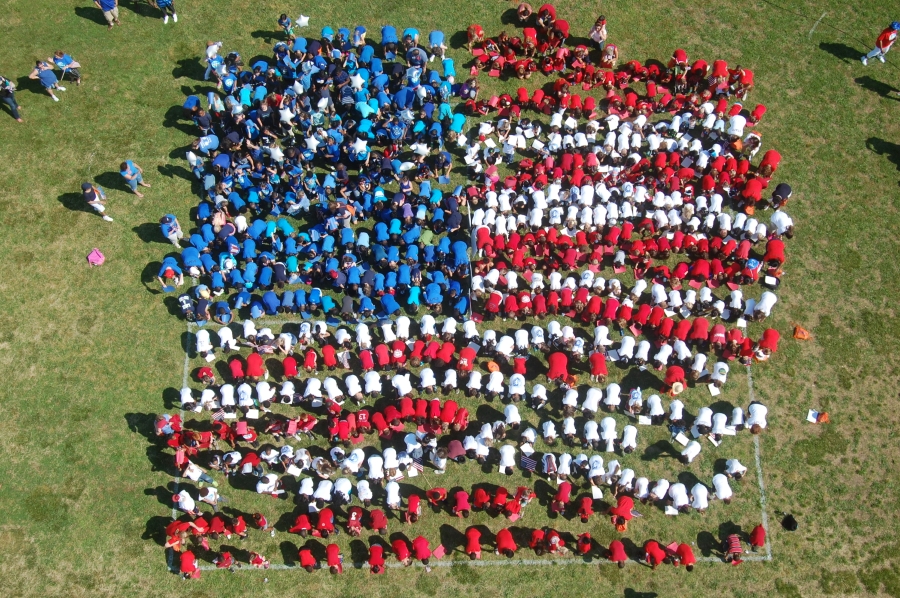 Students and staff create a U.S. flag.